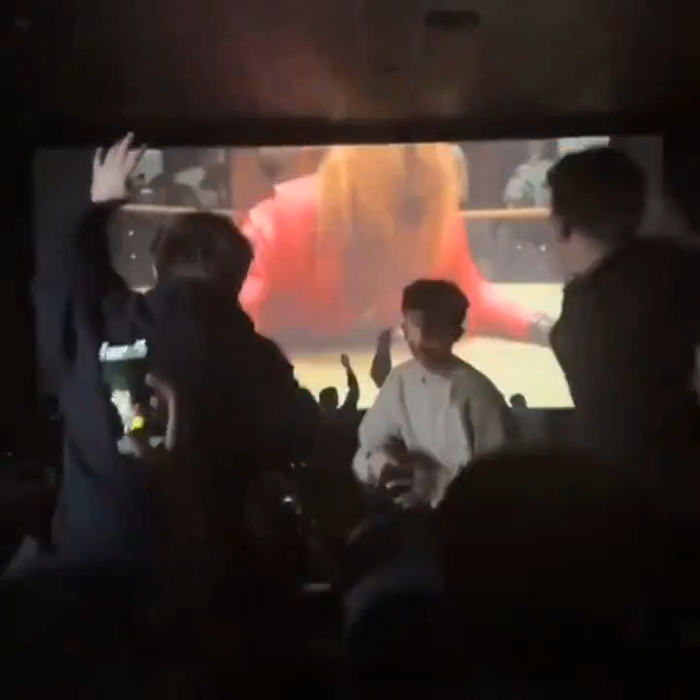 Audience reacts energetically during 'A Minecraft Movie' screening, amidst a TikTok trend disruption. Audience reacts energetically during 'A Minecraft Movie' screening, amidst a TikTok trend disruption.