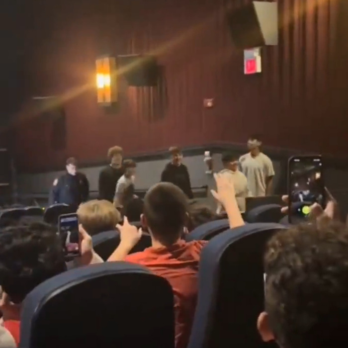 Audience in a theater during a rowdy TikTok trend related to 'A Minecraft Movie' screening disruption. Audience in a theater during a rowdy TikTok trend related to 'A Minecraft Movie' screening disruption.