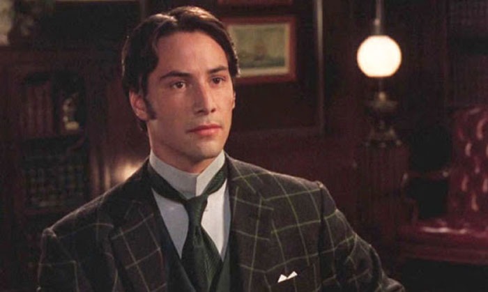 Actor in period suit, related to notable Hollywood casting decisions, in an elegantly furnished room.