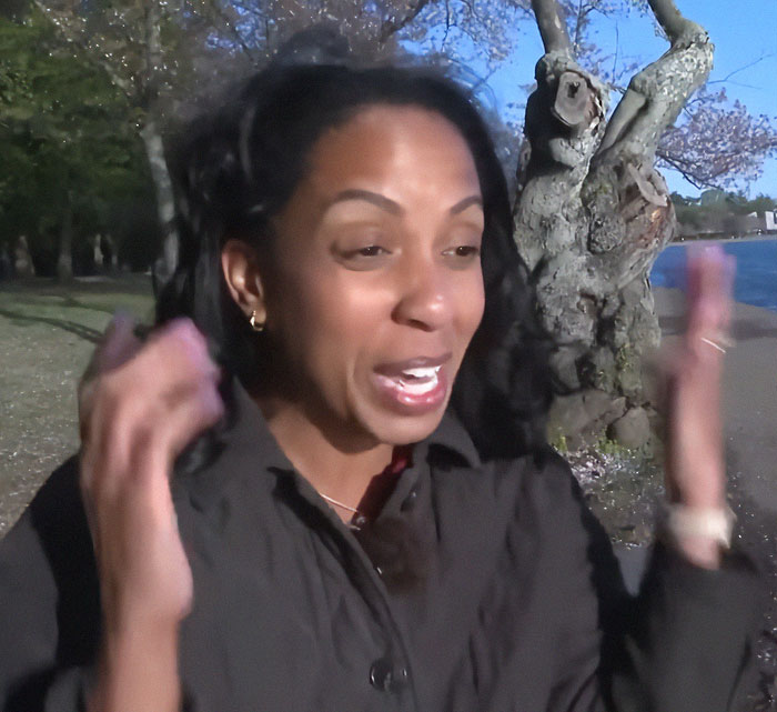 A surprised woman reacts joyfully outdoors during a kids' photo shoot moment with Barack Obama. A surprised woman reacts joyfully outdoors during a kids' photo shoot moment with Barack Obama.
