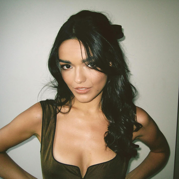 I don’t know who this person is, but they are posing confidently with long dark hair against a neutral background. I don’t know who this person is, but they are posing confidently with long dark hair against a neutral background.