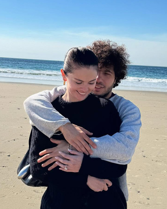 Couple embracing on the beach, capturing an intimate moment, with the ocean in the background. Couple embracing on the beach, capturing an intimate moment, with the ocean in the background.