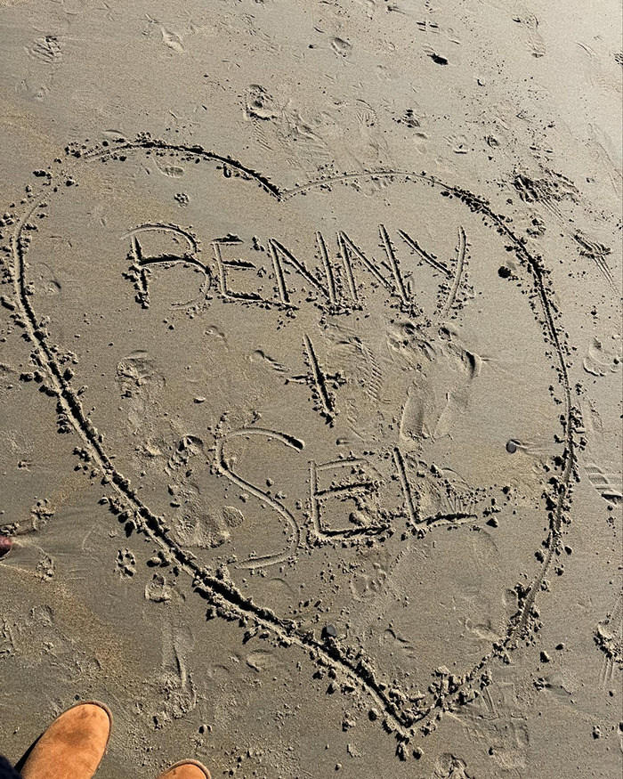 Heart drawn in sand with "Benny + Sel" inside, connected to intimate life theme. Heart drawn in sand with "Benny + Sel" inside, connected to intimate life theme.