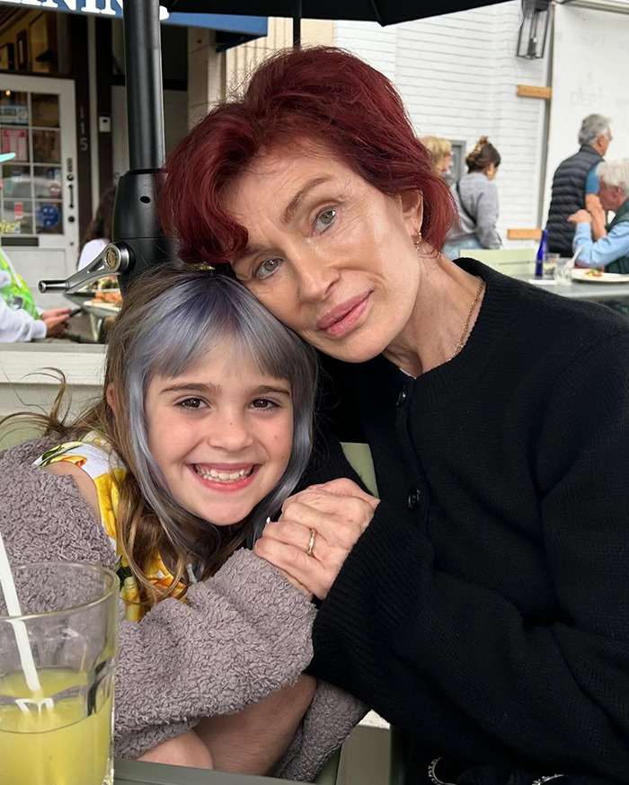 Grandmother and child smiling in a cozy restaurant setting, emphasizing family bond and genuine expressions. Grandmother and child smiling in a cozy restaurant setting, emphasizing family bond and genuine expressions.