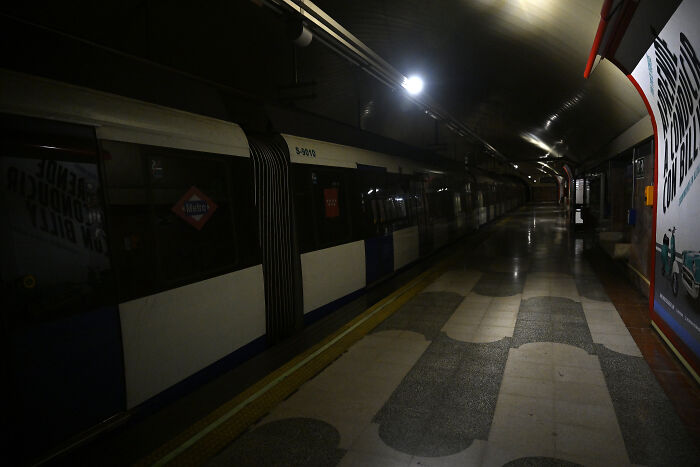 Dark underground train station platform with minimal lighting during a major blackout affecting millions in Europe. Dark underground train station platform with minimal lighting during a major blackout affecting millions in Europe.