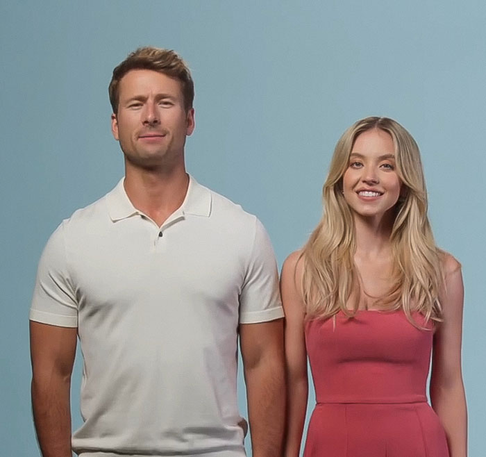 Young man in white shirt and woman in pink dress against a blue background, highlighting Sydney Sweeney's style choice. Young man in white shirt and woman in pink dress against a blue background, highlighting Sydney Sweeney's style choice.