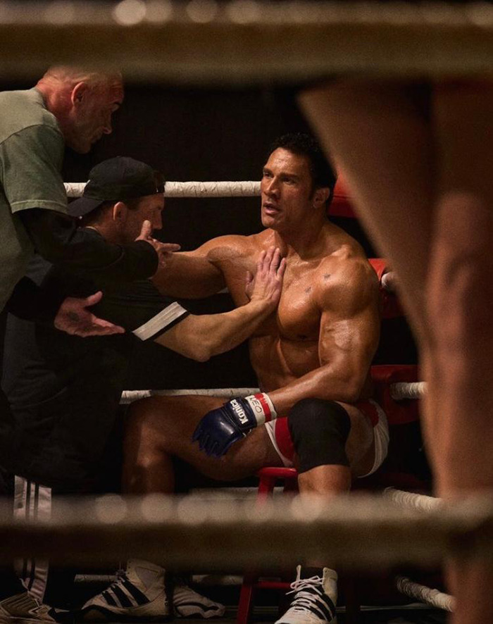 Muscular man in boxing ring surrounded by trainers, sparking racial confusion debate about Dwayne Johnson's film role. Muscular man in boxing ring surrounded by trainers, sparking racial confusion debate about Dwayne Johnson's film role.