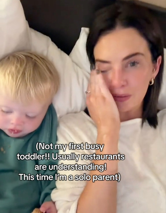 Mom with toddler, feeling emotional after restaurant incident over child not sitting. Mom with toddler, feeling emotional after restaurant incident over child not sitting.