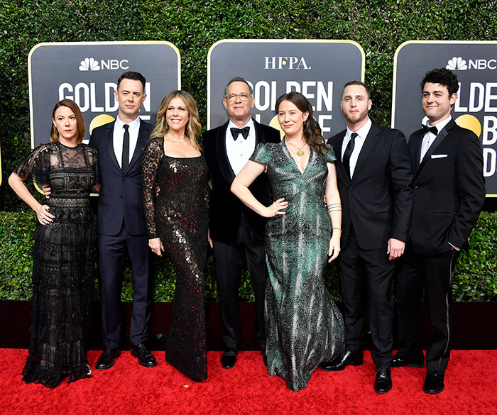 Group posing on the Golden Globes red carpet, highlighting childhood experiences. Group posing on the Golden Globes red carpet, highlighting childhood experiences.