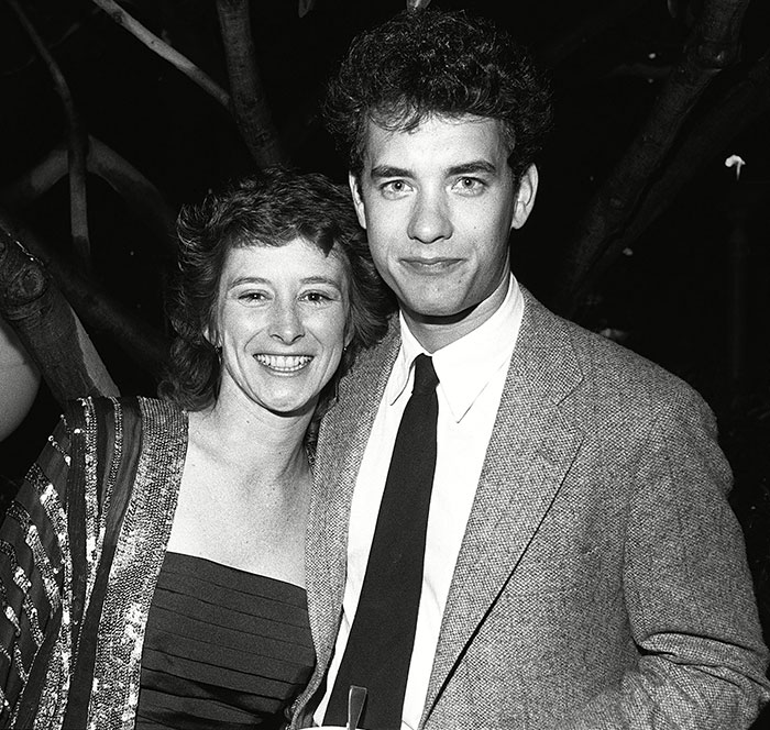 A man in a suit and a woman in a dress, smiling together outdoors, related to Tom Hanks’ daughter’s revelations. A man in a suit and a woman in a dress, smiling together outdoors, related to Tom Hanks’ daughter’s revelations.