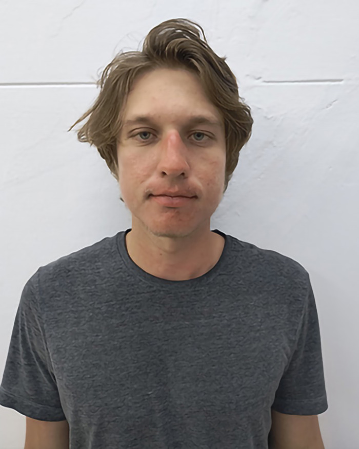 Man in a gray shirt against a white wall, associated with YouTuber Diet Coke stunt facing jail time. Man in a gray shirt against a white wall, associated with YouTuber Diet Coke stunt facing jail time.