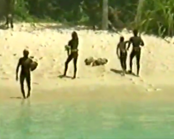 People on a remote beach, associated with a controversial YouTube stunt. People on a remote beach, associated with a controversial YouTube stunt.