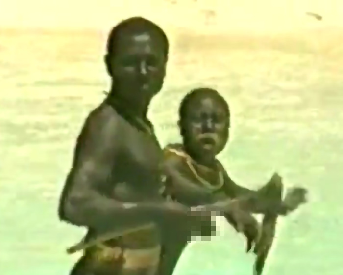 Indigenous tribe members in traditional setting, related to YouTuber stunt risking isolation. Indigenous tribe members in traditional setting, related to YouTuber stunt risking isolation.