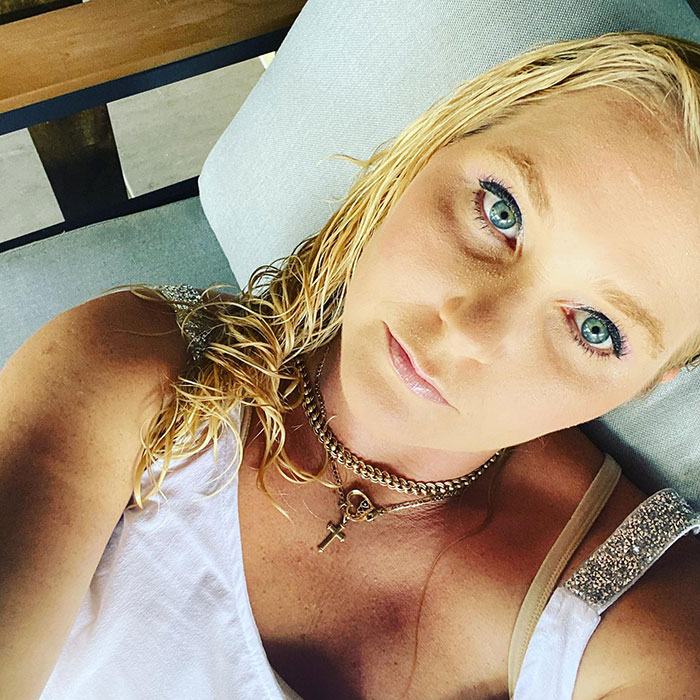 Close-up of a woman with blue eyes and wet blonde hair lying down, related to Virginia Giuffre lawyer claim doubt. Close-up of a woman with blue eyes and wet blonde hair lying down, related to Virginia Giuffre lawyer claim doubt.