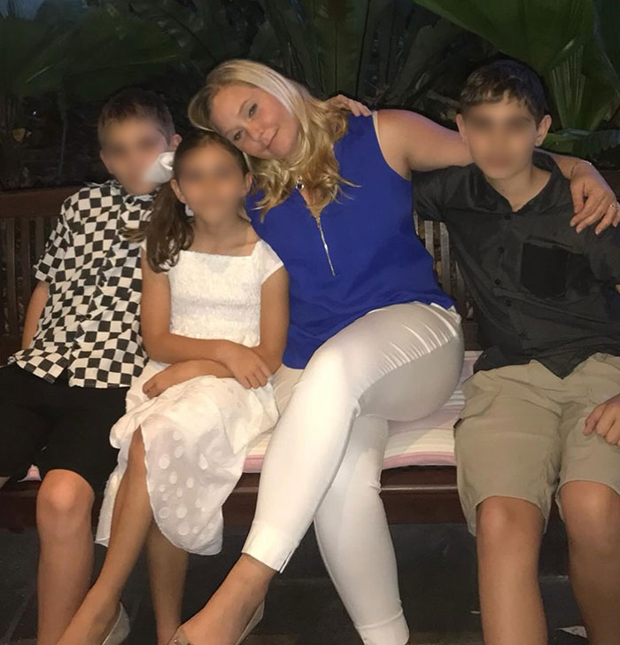 Woman in a blue top sitting on a bench with three children, related to news about a claim involving Prince Andrew’s accuser. Woman in a blue top sitting on a bench with three children, related to news about a claim involving Prince Andrew’s accuser.