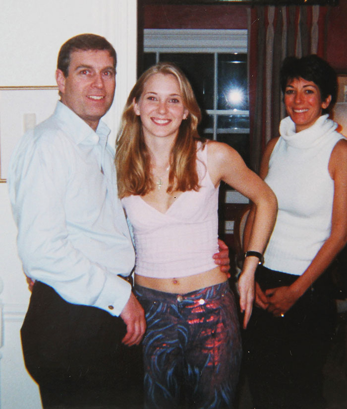 Three people posing together indoors amidst controversy surrounding Prince Andrew's accuser. Three people posing together indoors amidst controversy surrounding Prince Andrew's accuser.