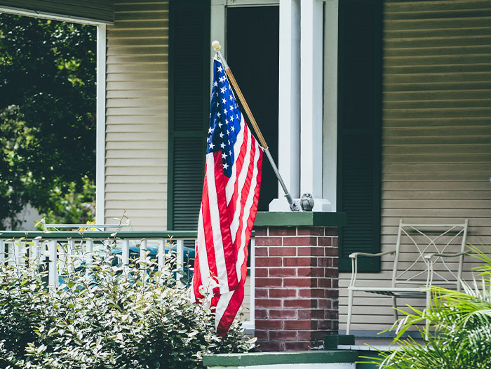 American flag on a porch, representing privacy and secrecy themes. American flag on a porch, representing privacy and secrecy themes.