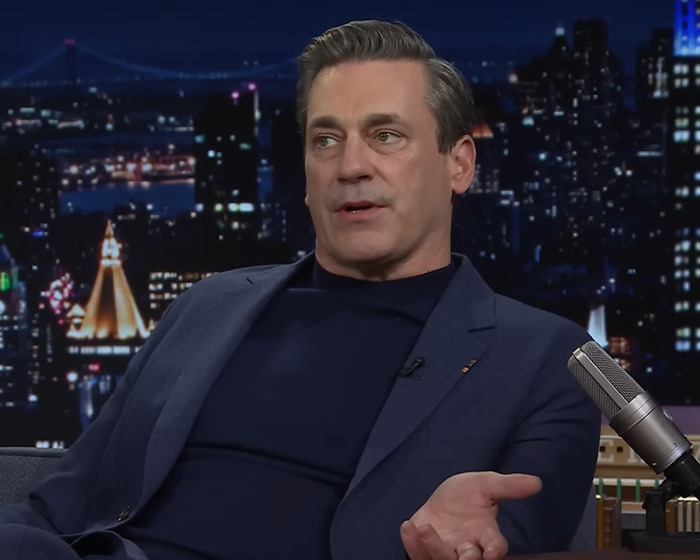 Actor discusses past incident on a talk show, wearing a blue suit with a cityscape backdrop. Actor discusses past incident on a talk show, wearing a blue suit with a cityscape backdrop.