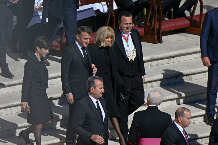 World leaders attending Pope Francis's funeral, walking down steps in formal attire. World leaders attending Pope Francis's funeral, walking down steps in formal attire.