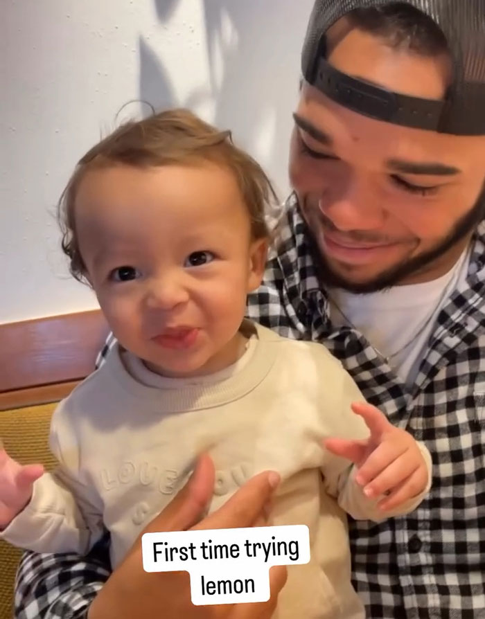 Father holding smiling toddler, labeled "First time trying lemon," related to TikTok star's tragic passing. Father holding smiling toddler, labeled "First time trying lemon," related to TikTok star's tragic passing.