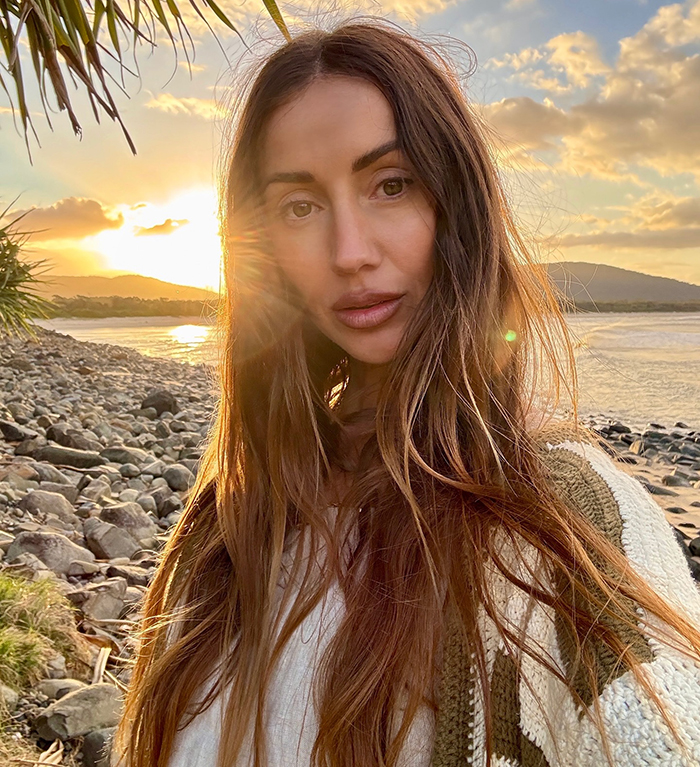 Big Brother star shows stunning body transformation after ditching veganism for meat, posing at sunset by rocky beach. Big Brother star shows stunning body transformation after ditching veganism for meat, posing at sunset by rocky beach.