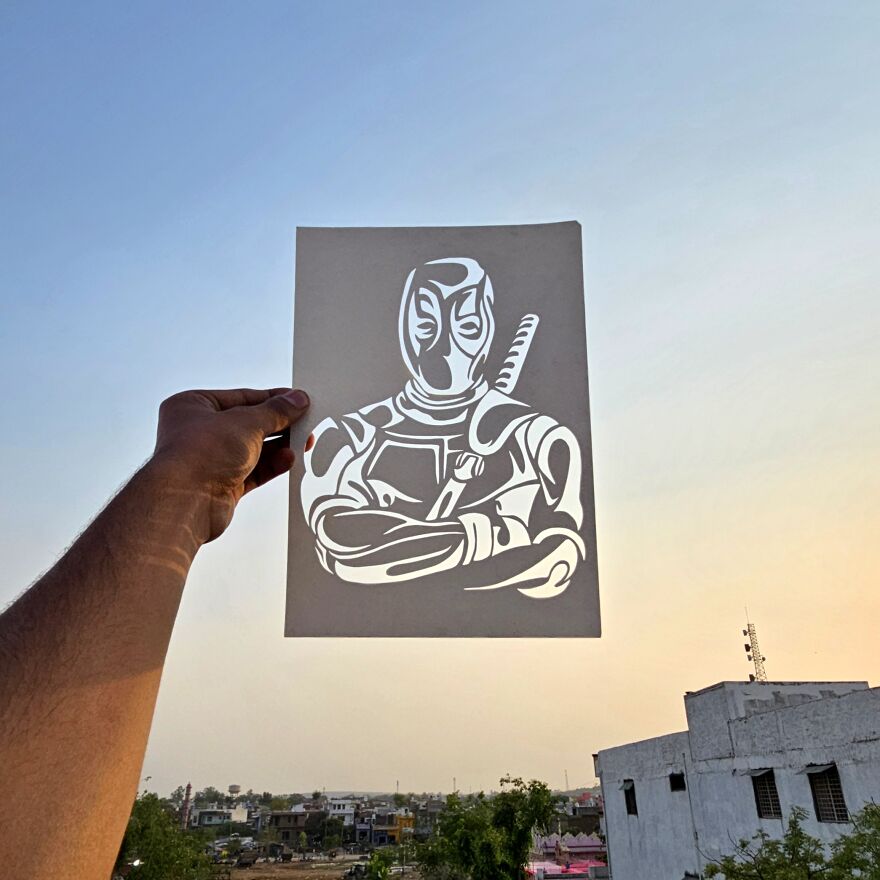 A Paper Cut Art Rendering Of The Deadpool Character, Created By Ayush Soni.