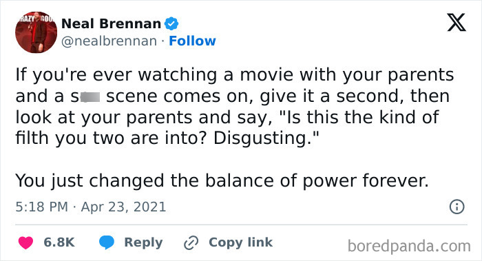 Tweet by Neal Brennan about handling awkward movie scenes with parents, a funny meme for daily laughs to improve your day.