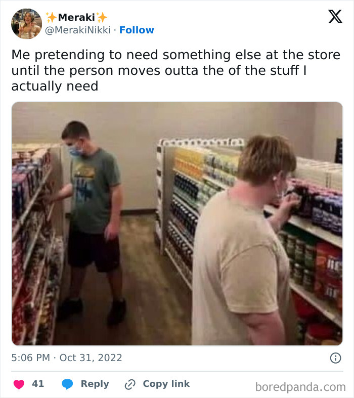 Two people in a store aisle, one pretending to browse while waiting, illustrating relatable memes about the human experience.
