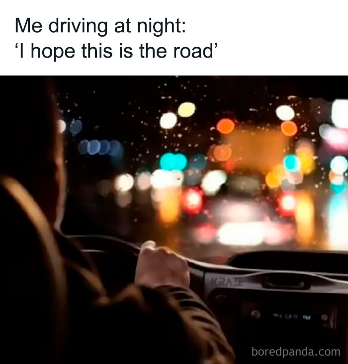 Driver at night gripping steering wheel with blurred city lights ahead, illustrating a sarcastic meme about uncertain driving.