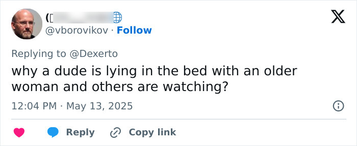 Tweet text on a social media interface questioning a scene involving a man lying in bed with an older woman while others watch. Tweet text on a social media interface questioning a scene involving a man lying in bed with an older woman while others watch.
