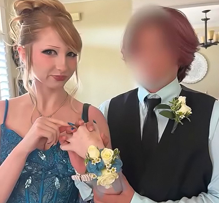 Teen girl in blue prom dress with corsage holding hands with a young person in vest, linked to Christian school expulsion debate. Teen girl in blue prom dress with corsage holding hands with a young person in vest, linked to Christian school expulsion debate.