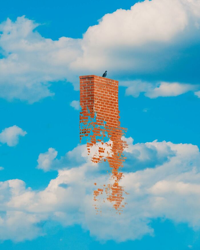 Surreal photo manipulation of a floating, dissolving brick chimney with a bird perched against a blue sky with clouds.