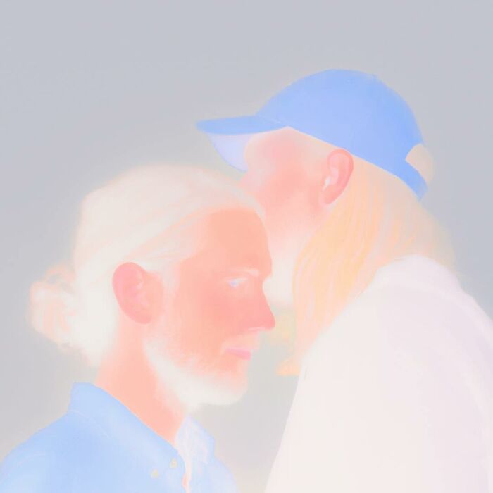 Surreal photo manipulation of two people close together, featuring soft pastel colors and dreamy lighting effects.