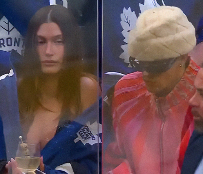 Hailey Bieber looking somber at a sports event while Justin Bieber wears sunglasses and a fur hat nearby. Hailey Bieber looking somber at a sports event while Justin Bieber wears sunglasses and a fur hat nearby.