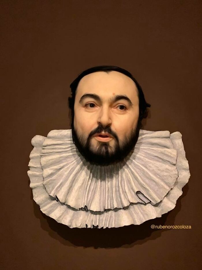 Hyper-realistic sculpture of a bearded man with detailed facial features and a textured ruffled collar by Ruben Orozco Loza.