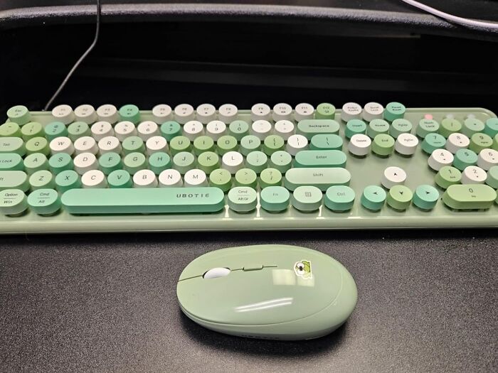 Green retro-style keyboard and wireless mouse shown as office supplies that enhance desk appeal.