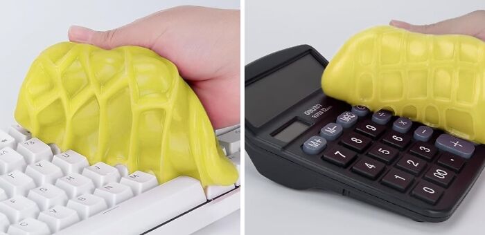 Yellow cleaning slime removing dust from white keyboard and black calculator, useful office supplies for desk organization.
