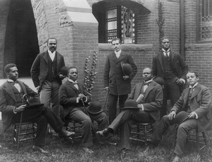 Group of well-dressed African American men posing outdoors, capturing African American life at 1900 Paris Exposition.