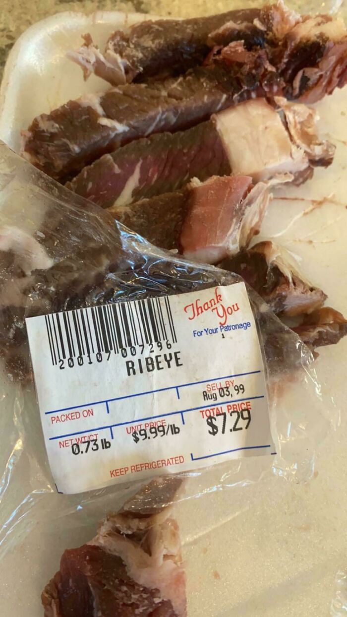 Slices of ribeye steak on a plate with a packaged ribeye label, one of the bizarre things found in old houses.