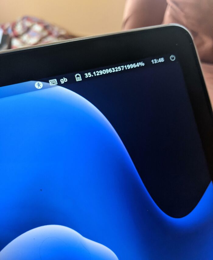 Tablet screen showing a battery percentage glitch at 35.129096325719964% illustrating technology disasters and errors.