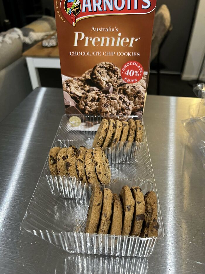 Arnott's Premier chocolate chip cookies in smaller packaging highlighting product size and cost changes.