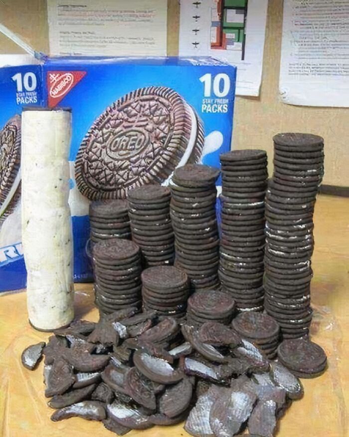Stacks of Oreo cookies separated by cream filling next to a single tall stack of only filling, a cursed image for a weird break.