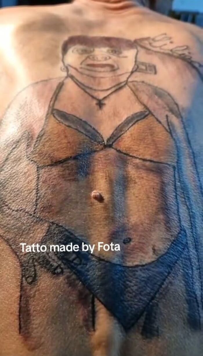 Tattoo of a poorly drawn person in a bikini on a back, showing one of the funniest permanent tattoo mistakes.