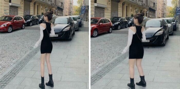 Young woman in a black dress and boots walking on a city sidewalk, highlighting influencer heavy editing on Instagram posts.