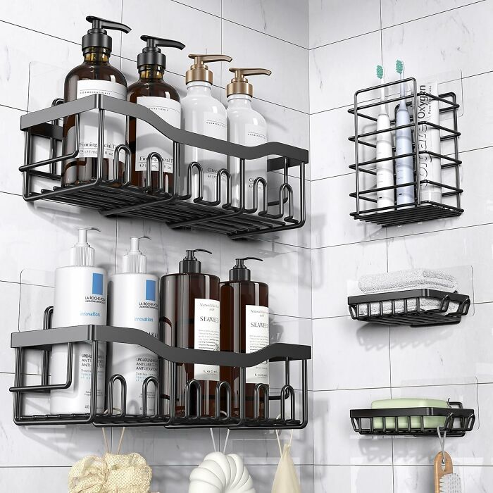 Black metal corner shelves holding bottles and toiletries in a bathroom, showcasing popular internet gold products on Amazon.