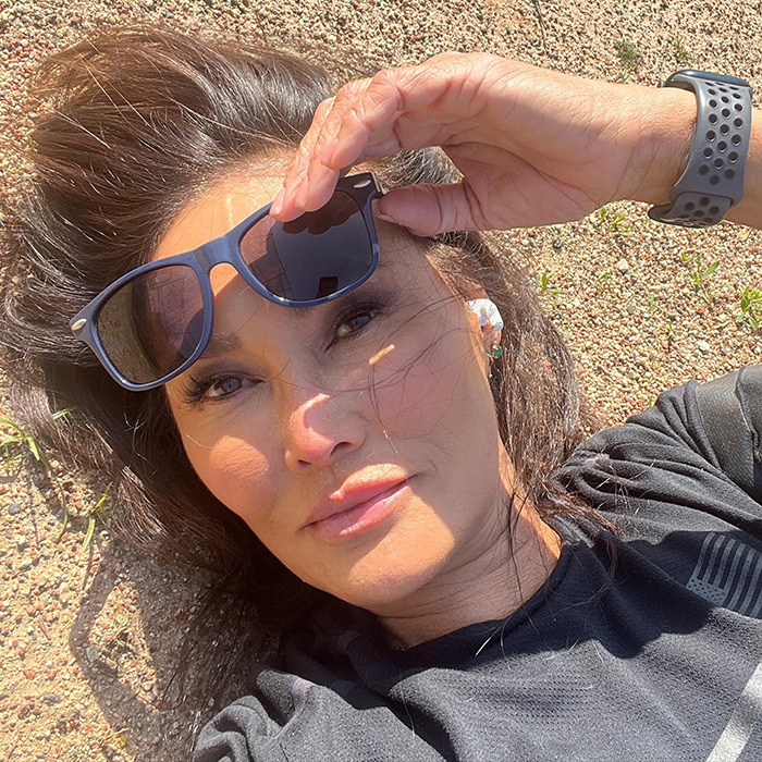 Tia Carrere close-up selfie outdoors, wearing black shirt and sunglasses, showcasing her youthful look and natural beauty. Tia Carrere close-up selfie outdoors, wearing black shirt and sunglasses, showcasing her youthful look and natural beauty.