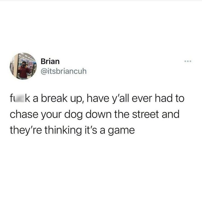 Tweet about relatable shower feels comparing chasing a dog on the street to breakup feelings in a humorous tone.