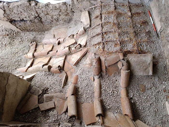 Archaeological site in Pompeii revealing remains linked to parents' tragic attempt to shield child during eruption. Archaeological site in Pompeii revealing remains linked to parents' tragic attempt to shield child during eruption.