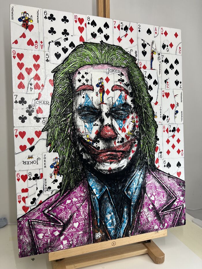 Photo manipulation collage of a joker portrait made with playing cards featuring vibrant colors and detailed artwork.