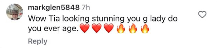 Comment praising 90s icon Tia Carrere for looking stunning and ageless with heart and fire emojis. Comment praising 90s icon Tia Carrere for looking stunning and ageless with heart and fire emojis.